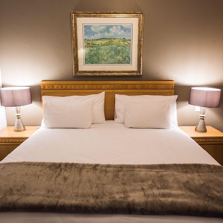 Airport Inn And Suites Іденвейл Екстер'єр фото